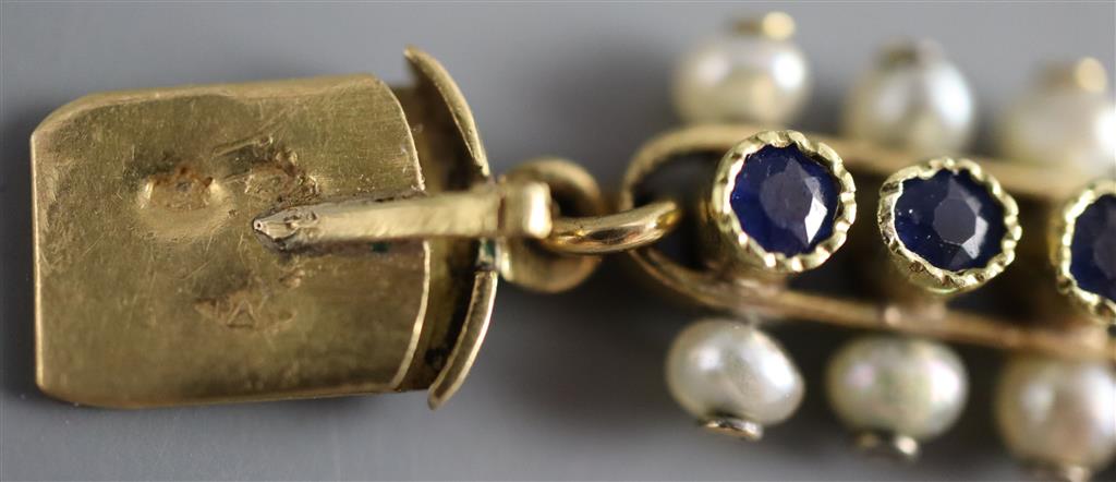 A late 19th/early 20th century French 18ct gold, sapphire and seed pearl set bar and circular link bracelet,